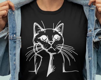 May include: A black t-shirt with a white line drawing of a cat looking up and to the right.