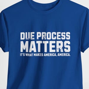 May include: Royal blue t-shirt with white text that reads "Due Process Matters. It's what makes America, America."
