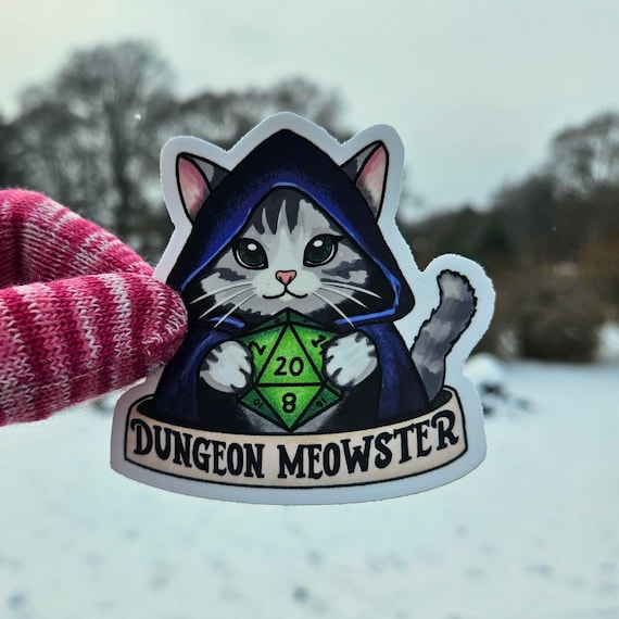 Dungeon Meowster D20 Sticker | TTRPG Tabletop RPG Dungeon Master Fantasy Cat Holding D20 Dice Roleplaying Gamer Gift Waterproof Vinyl Decal