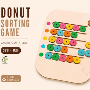 Könnte beinhalten: Holz-Donut-Sortierspiel mit bunten Donuts und farblich passenden Stiften. Das Spielbrett trägt den Text "DONUT SORTING GAME" und "LASER CUT FILES". Enthält SVG- und DXF-Dateien zum digitalen Download.