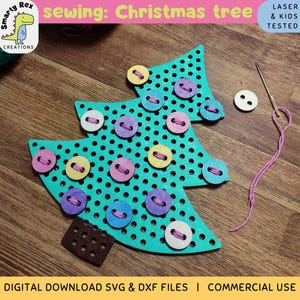 May include: A teal blue wooden Christmas tree with a grid pattern and holes for sewing on buttons. The tree has a brown base and is surrounded by colorful buttons, a needle, and pink thread.