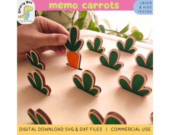 May include: A wooden memo game with a carrot and green leaves. The game is laser cut and kid-tested. The game is called "memo carrots".