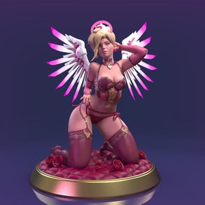 May include: A pink and white angel wing statue with a female figure wearing a pink and gold lingerie outfit. The figure is kneeling on a red velvet cushion with roses.