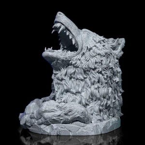 May include: A detailed gray 3D printed sculpture of a wolf howling with its mouth open, sitting on a rocky base.
