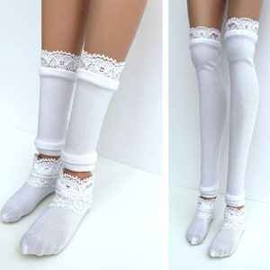 May include: White knee-high socks with lace trim. The socks are made of a soft, stretchy material and have a comfortable fit.