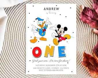 May include: A white invitation with black polka dots. The invitation says "Andrew is turning one" with a large colorful "ONE" and cartoon images of Mickey Mouse and Donald Duck. The invitation includes the date, time, address, and RSVP information.