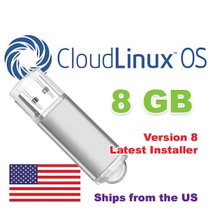 May include: A silver USB flash drive with a clear plastic cap. The text "CloudLinux OS" and "8 GB" are displayed. The words "Version 8 Latest Installer" are also visible. An American flag is in the lower left corner.