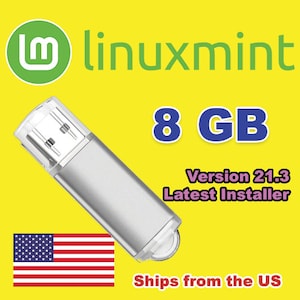 Puede incluir: Unidad flash USB plateada de 8 GB con el logotipo de Linux Mint y el texto "Version 21.3 Latest Installer" sobre un fondo amarillo. También se ve la bandera estadounidense.