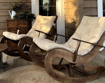 Cozy rocking chair for the terrace. Handmade furniture. Author's chair made of wood. Stylish rocking chair