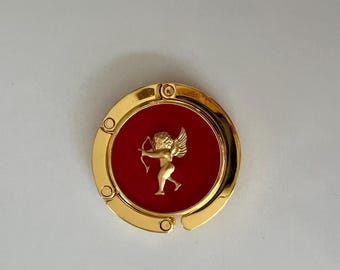 Cupid Bag Hook: Gold Foldable Purse Hanger with Cherub on Red Resin