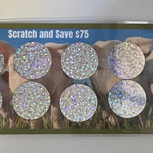 May include: A card with eight silver scratch-off circles and the text "Scratch and Save $75" and "Chatty Kathy Budgets".