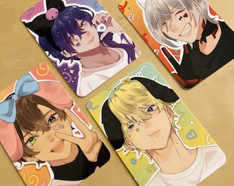 May include: Four colorful cards with illustrations of anime characters. Each card has a different character with a unique hairstyle, clothing, and accessories. The cards have a bright, colorful background with hearts, stars, and swirls.