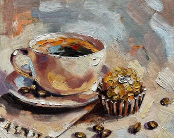 May include: A white coffee cup with a brown saucer and a small, round, golden brown muffin on a beige napkin with coffee beans scattered around.