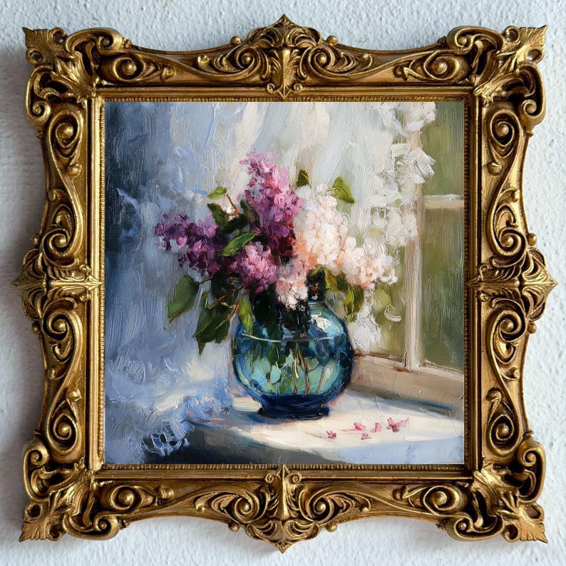 May include: An oil painting of a bouquet of purple and white lilac flowers in a round blue glass vase, set on a ledge near a window. The artwork is encased in an ornate, heavy gold-colored frame with intricate scrollwork and decorative carvings.