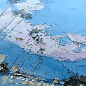 May include: An oil painting featuring a textured impasto technique with thick paint strokes. The scene depicts tall, slender palm trees against a bright blue sky filled with soft, layered clouds in shades of white and pale pink, with dark foliage below.