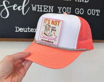 It’s Not Easy Being a Cowgirl Orange Summer Trucker Hat