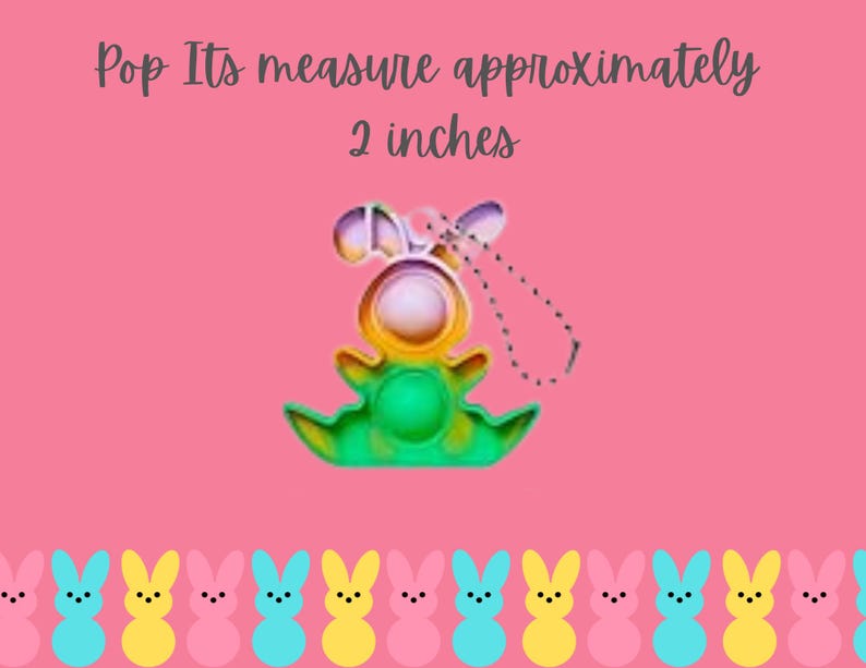 May include: A colorful pop it toy shaped like a bunny with a green, yellow, and blue design. The toy is approximately 2 inches tall and has a string attached to it. The toy is surrounded by a row of pastel pink, yellow, and blue bunny-shaped candies.