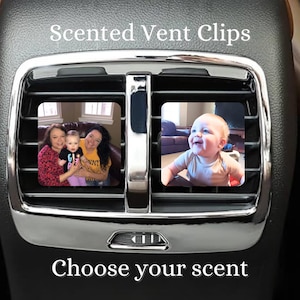 May include: Two images of people in car vent clips. The text "Scented Vent Clips" is at the top of the image. The text "Choose your scent" is at the bottom of the image.