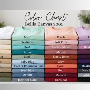 May include: A color chart displays a variety of Bella Canvas 3001 t-shirt colors. The chart includes shades like white, mint, peach, and lavender, with additional colors such as natural, seafoam, soft pink, lilac, cream, teal, and heather mauve.