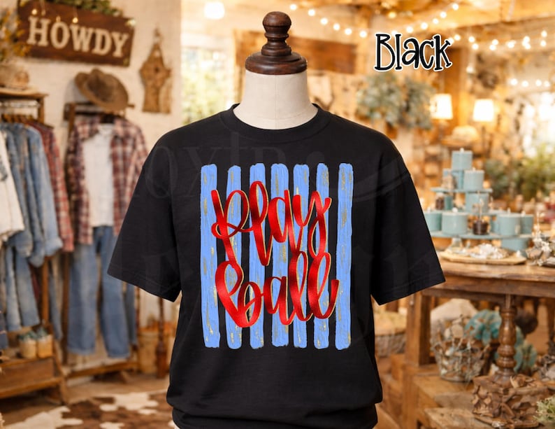 May include: Black t-shirt with the words "Play Ball" in red script. The design features vertical light blue stripes. The shirt is displayed on a mannequin.