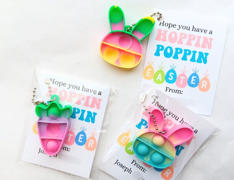 May include: Three Easter-themed gift tags with colorful pop-it fidget toys attached. The tags say "Hope you have a Hoppin Poppin Easter" and "From:".