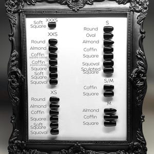 May include: A white board with a black frame displays a chart of nail shapes and sizes. The chart shows different nail shapes, including round, almond, coffin, square, soft square, and squoval. The chart also shows different sizes, including XXXS, XXS, XS, S, S/M, and M.