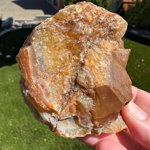Buckskin Carnelian agate nodule with golden crystal center. Cut to stand, polished to see inside the agate. Collected from southern Oregon.