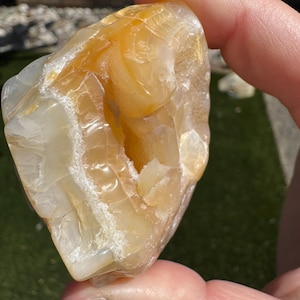 Agate with fortifications and cavern. Specimen tumbled to preserve natural shape and character of the rock. Collected in southern Oregon