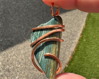 Caldera Jasper pendant with custom hammered copper wrap. Aka Gary Green, Larsonite, it’s really a fossil of petrified bog wood.