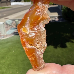 Carnelian agate with fortification lines and epimorphs, cut and tumbled. Nice pocket rock or worry stone. Collected and tumbled from Oregon