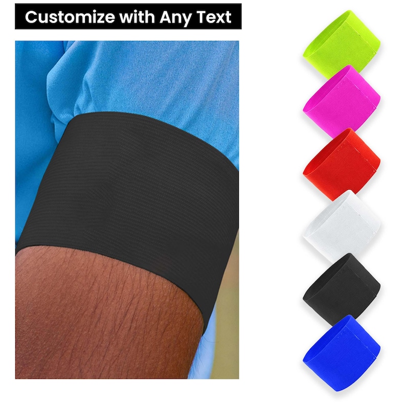 May include: Black arm band with a blue shirt sleeve.  The arm band is shown in multiple colors: green, pink, red, white, black, and blue.