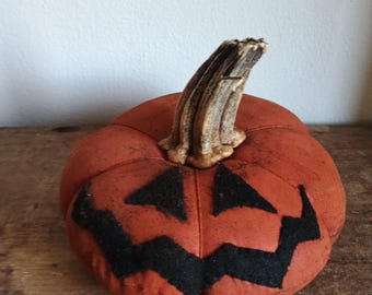 Calabaza plana primitiva tipo Jack-O'-Lantern