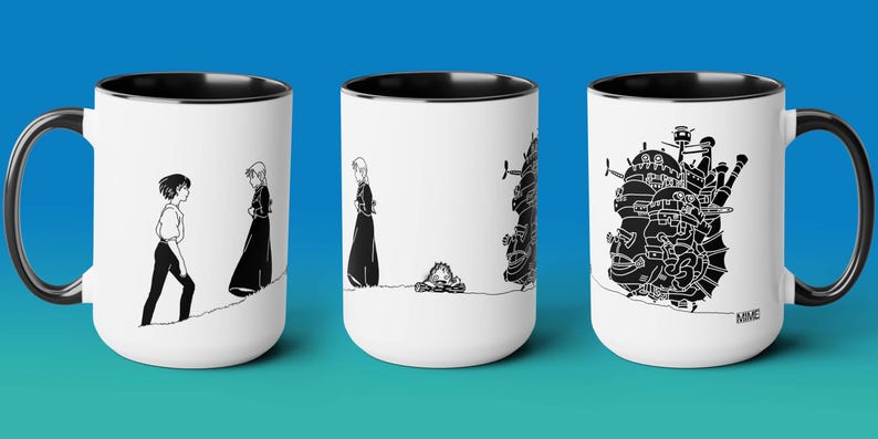 May include: Set of three white ceramic mugs with black handles and black interior. Each mug features a black and white illustration from the animated film 'Howl's Moving Castle'. The first mug shows the characters Sophie and Howl walking away from each other. The second mug shows Howl's Moving Castle. The third mug shows Sophie and Howl walking towards each other.