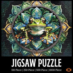 May include: A jigsaw puzzle featuring a detailed illustration of a green frog with large eyes, centered within a teal and gold mandala design. The puzzle is labeled "JIGSAW PUZZLE" with options for 110, 250, 500, and 1000 pieces.