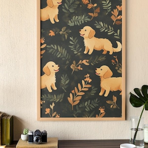 May include: A framed print featuring a repeating pattern of golden retriever puppies amidst a dark green background with botanical elements in shades of green and orange. The artwork is displayed on a wooden desk with a camera, books, and a laptop.