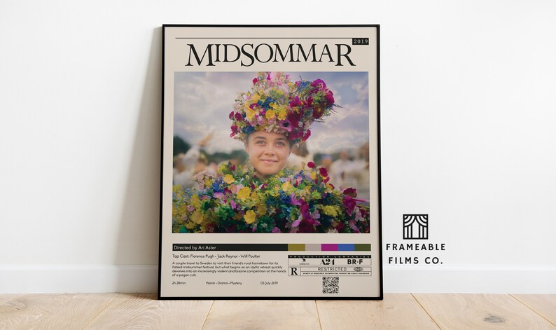 May include: A movie poster for the film "Midsommar" featuring a woman wearing a flower crown and a floral dress. The poster is in a vintage style with a black frame and a white background. The text on the poster reads "Midsommar" and "2019".