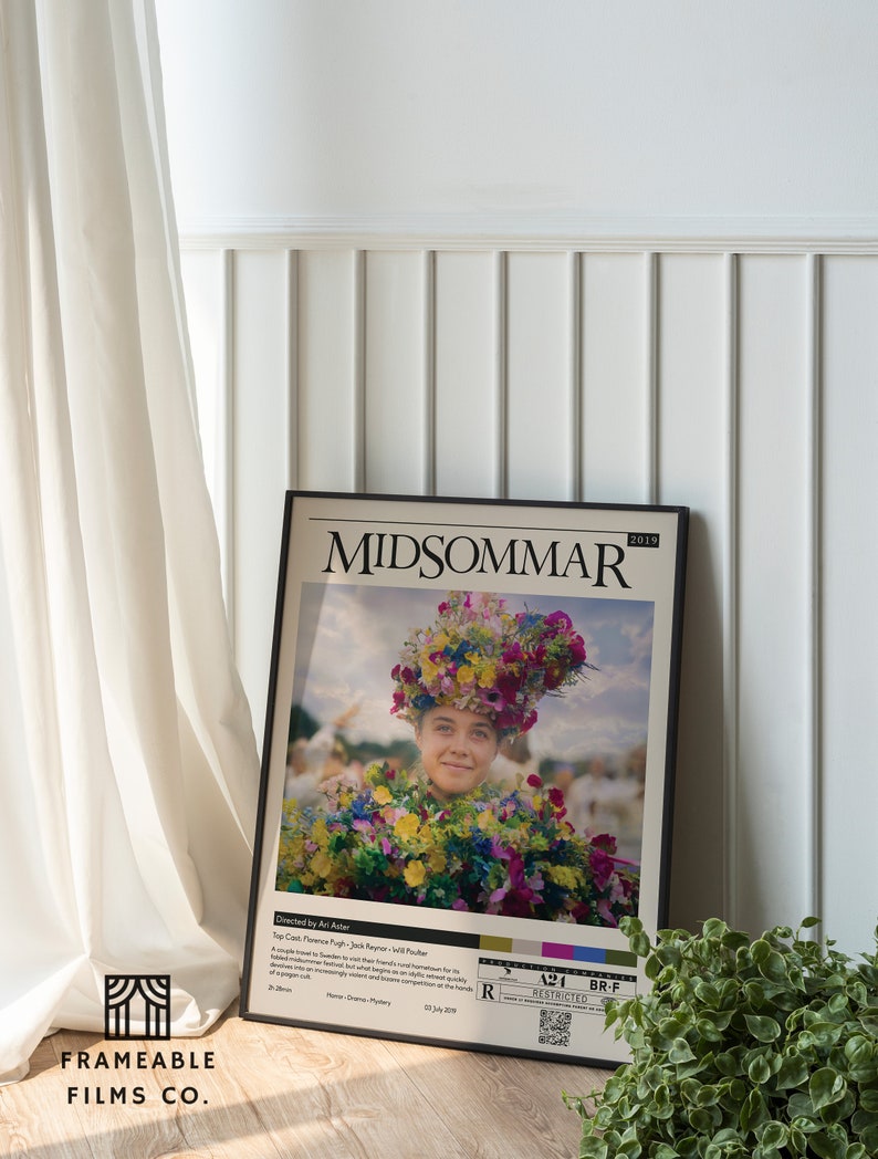 May include: A movie poster for the film "Midsommar" featuring a woman wearing a flower crown and a floral dress. The poster is framed in black and has a white background. The text on the poster reads "Midsommar" and "2019".