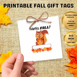 May include: A square white gift tag featuring a brown squirrel illustration, the text Hello FALL!, and a blank space for names. The tag is tied with brown twine and measures 3x3 inches. It is an editable Canva template for fall gifts.