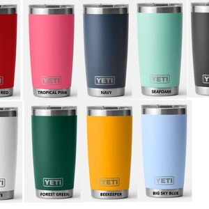 May include: A selection of insulated tumblers in colours such as red, pink, navy, seafoam, black, white, forest green, yellow, and light blue. Each tumbler has a silver rim and base, with the "YETI" logo displayed.