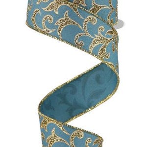 May include: Decorative teal ribbon with gold glitter accents and a swirling pattern. The ribbon is on a white spool. The edges are trimmed with gold glitter. This ribbon is suitable for gift wrapping, crafts, and holiday decorations.