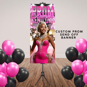 May include: A custom prom send-off banner featuring a woman in a pink dress, surrounded by pink and black balloons. The banner reads "PROM Amaya's SEND OFF" in pink and white text. The banner is on a black tripod.