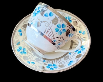 Taza y platillo de porcelana One Empire, con ribete de platino y diseño floral turquesa, Inglaterra.