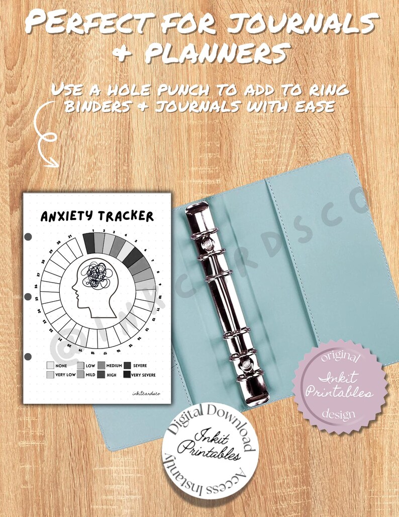 May include: Anxiety tracker printable with a circular design, featuring a head silhouette and a scale from none to very severe. The tracker is shown inside a light blue binder with a silver ring mechanism. The text reads "Perfect for Journals + Planners."