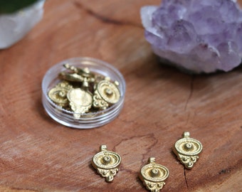 Brass charms