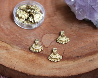 Brass charms