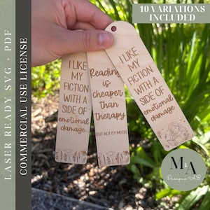 May include: Three wooden bookmarks with engraved text and floral designs. The bookmarks read: "I like my fiction with a side of emotional damage" and "Reading is cheaper than therapy (but not by much)." The image also includes the text "Laser Ready SVG + PDF" and "Commercial Use License."