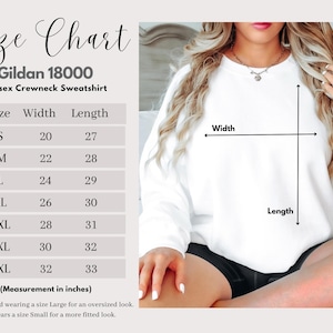 May include: White Gildan 18000 unisex crewneck sweatshirt with a size chart. The chart shows measurements in inches for sizes S to 4XL. The model is wearing a size Large for an oversized look. The model is 5'4.
