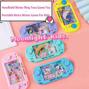May include: Several handheld water ring toss game toys in shades of pink, blue, and yellow. Each toy has a retro design with buttons and a screen showing a water-filled scene with floating rings. The text "Handheld Water Ring Toss Game Toy" is visible.