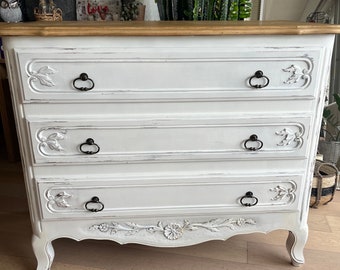 white chest of drawers with patinated aged effect