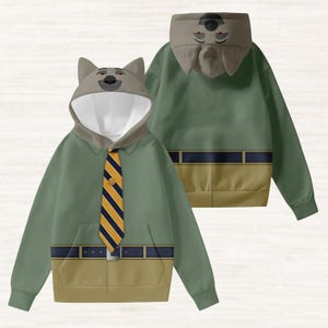 May include: A green hooded sweatshirt with a wolf face on the hood and a yellow and blue striped tie design. The sweatshirt has a front pocket and a belt design at the waist. The back of the sweatshirt is also visible.